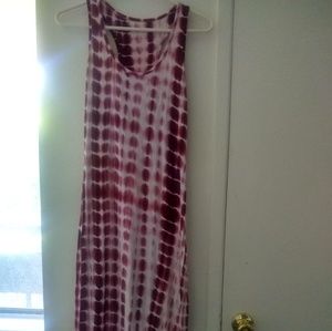 A lovely fitted sundress , loose at the buttom